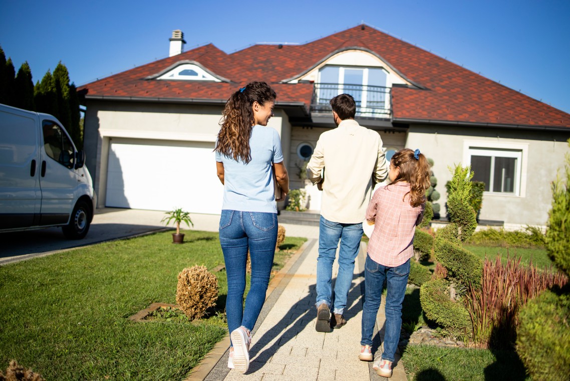 Happy family just bought a new house and moving in.